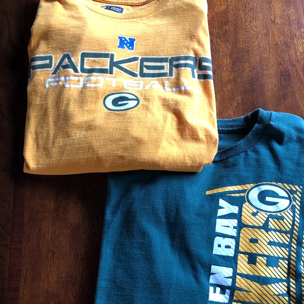 Two long sleeve Green Bay Packer t-shirts.